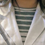 Person in Puts Lab labcoat with pipette