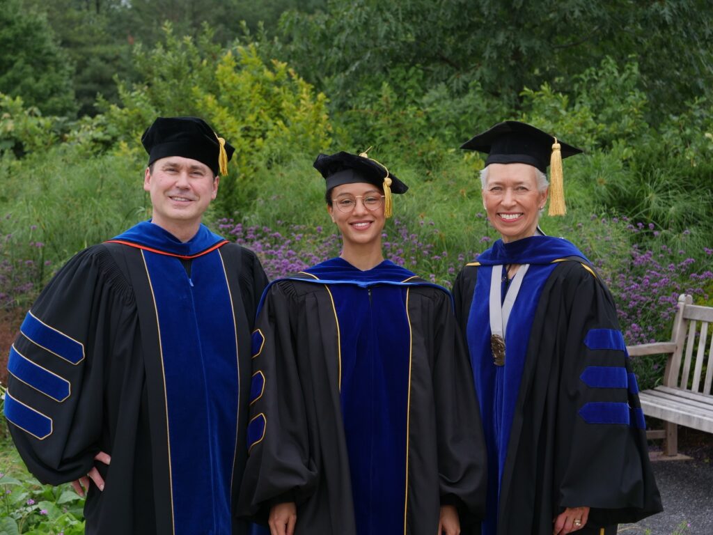 Photo of Dr. Mark Shriver, Dr. Tina Lasisi, and Dr. Nina Jablonski at Lasisi's graduation